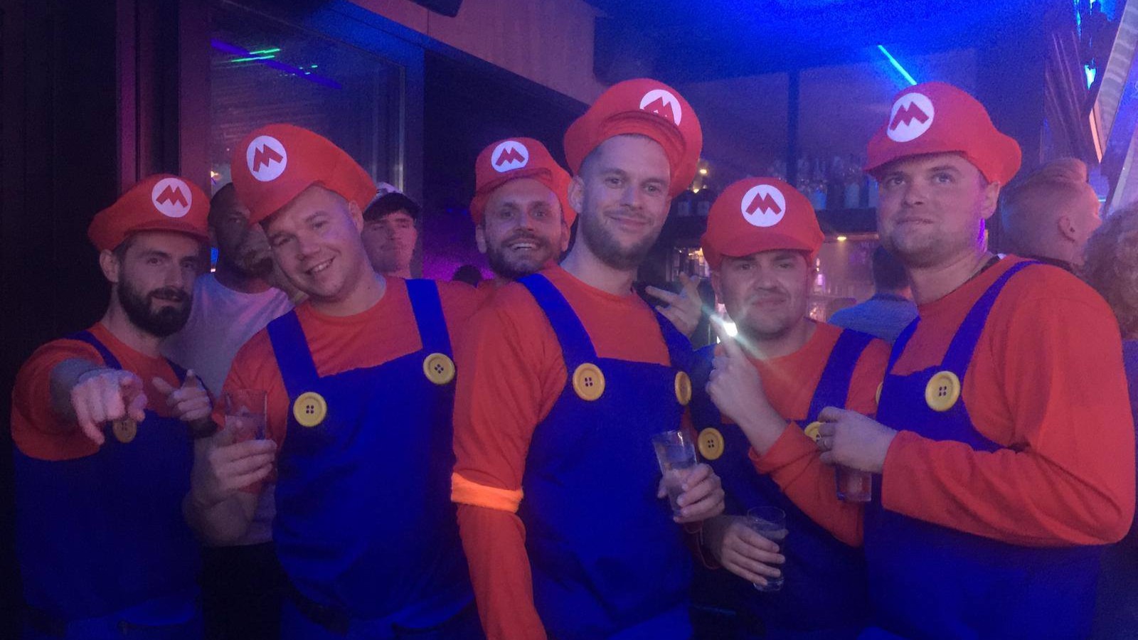 stag groug dressed as Mario Bros